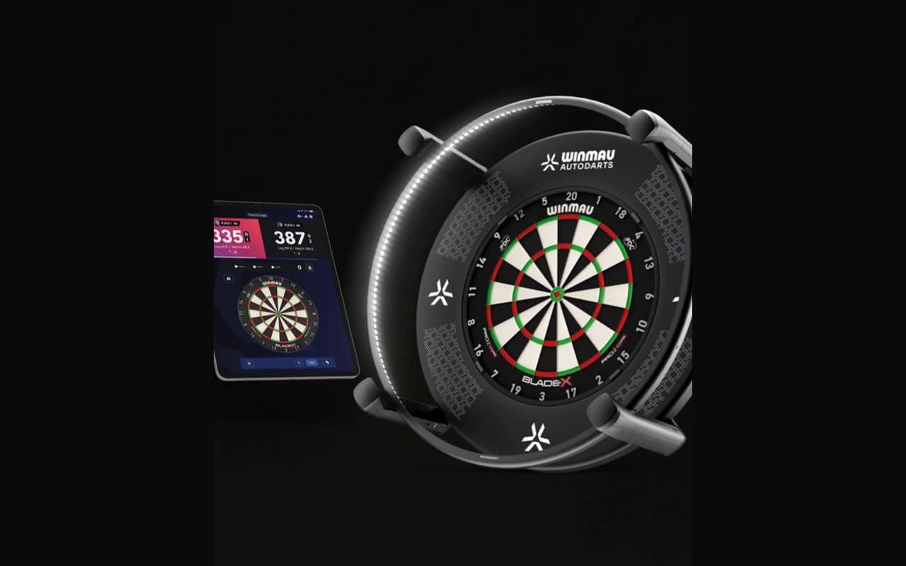 Winmau Autodarts X camera scoring ring around a dartboard, with the scoring app on a tablet